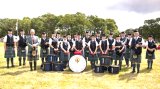 A Band photo with our patron, Sir Malcolm Colquhoun, at Luss Highland Games in 2015.