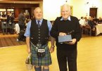 Malcolm Gilmour receiving a quaich and the obligatory bottle from the pipe band after his retirement from the band in 2015. Malcolm joined Helensburgh Pipe Band in 1948 and has been a stalwart member for 67 years. Good luck in your retirement Malcolm.